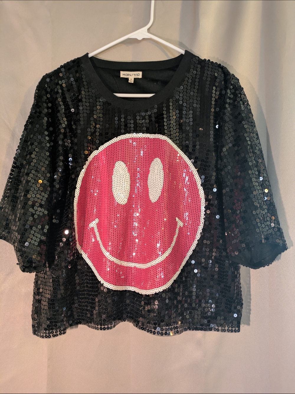 Mainstrip Black Sequin Tee with Pink Smile Graphic